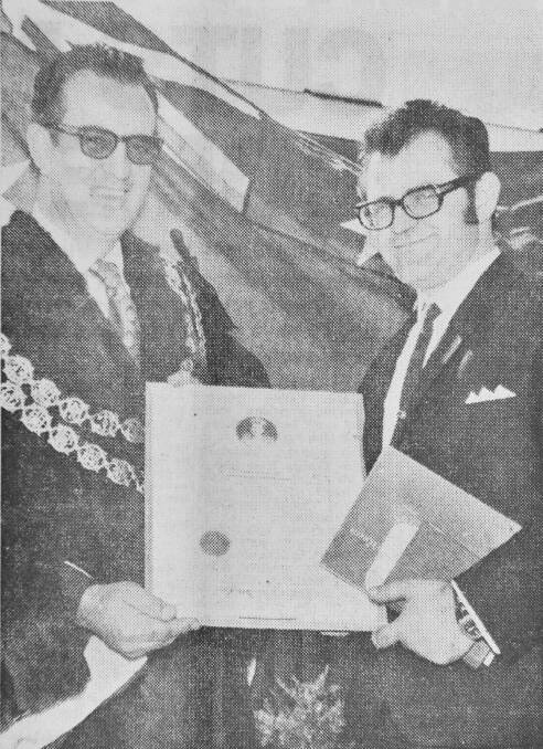 Mr Tziallas received his certificate of naturalisation Mayor Cr DE Elliott.

