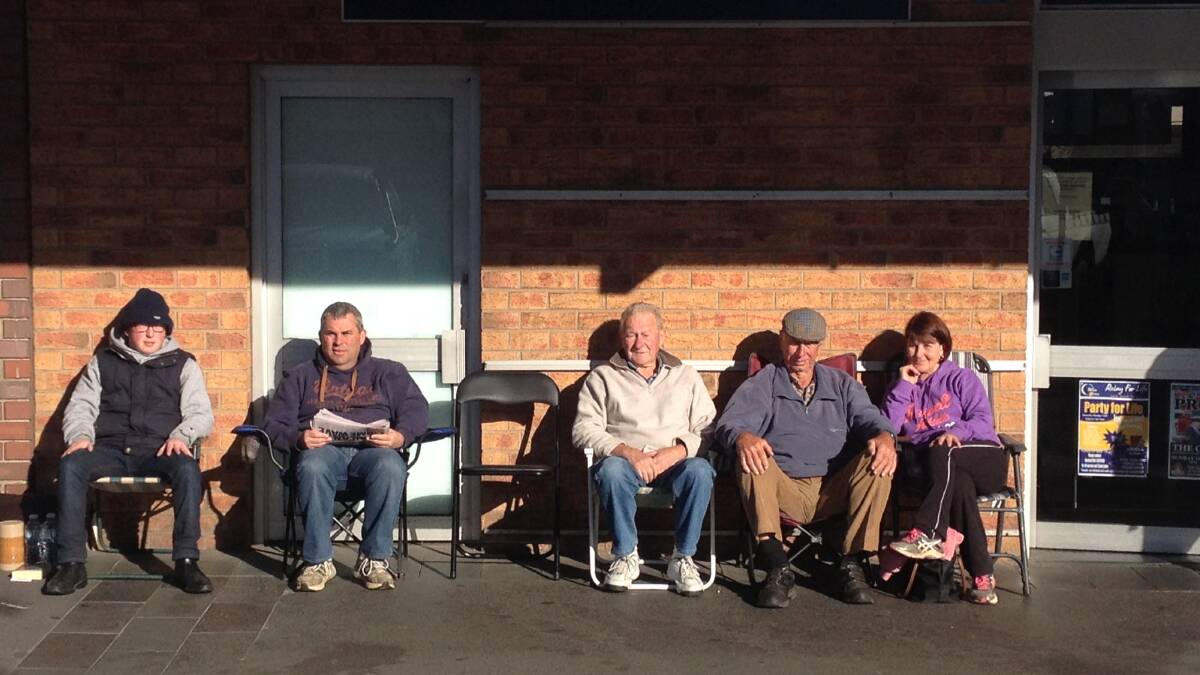 Cadell, Nigel, Russell, Dermott and Joanne outside Bendigo's Queen Street newsagency this morning. 