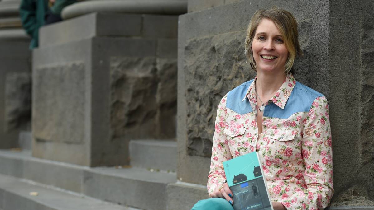Writer: Julie Proudfoot with her book, The Neighbour. Picture: JODIE DONNELLAN