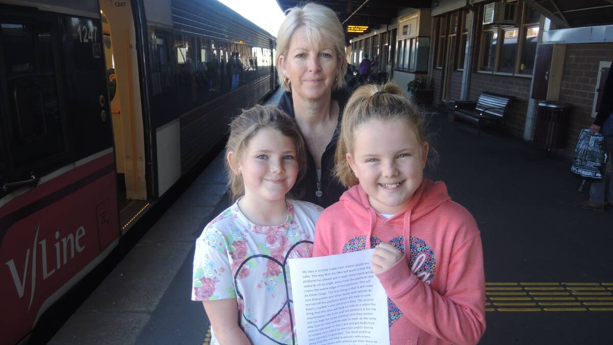 Idea: Sophie, 8, mum Kim and Lily Giles, 10, at Bendigo train station on Friday.