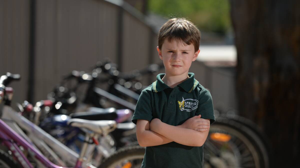 Spring Gully Primary School student Will Smith, 7, is upset after someone stole his bike. Picture: JIM ALDERSEY 