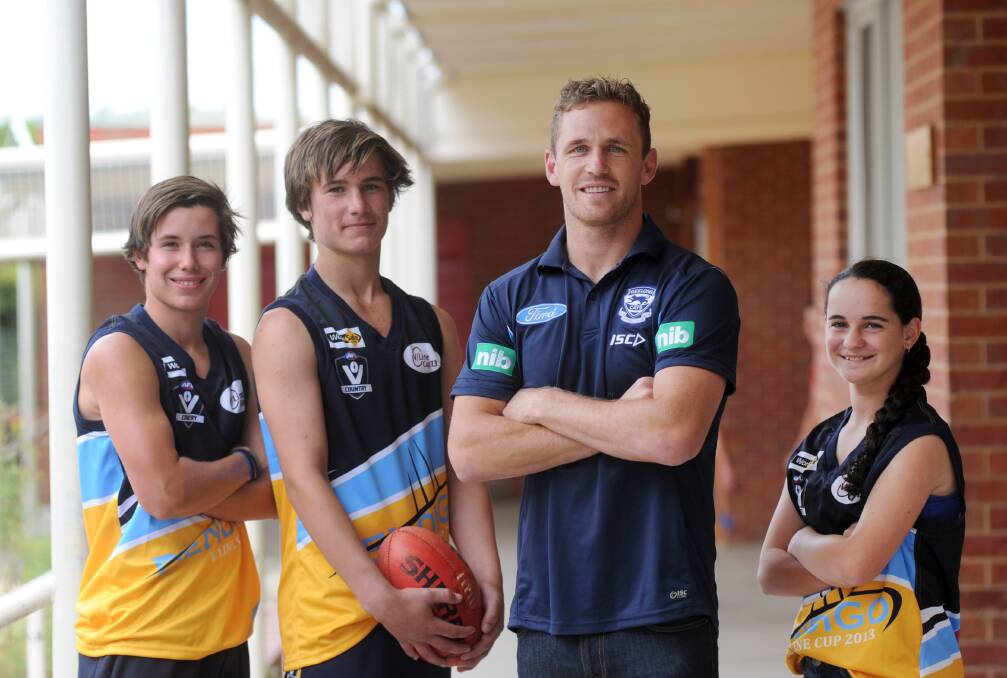 ROLE MODEL: Ambassador Joel Selwood with junior players Seb Spijkeman (left), Lachie Wallace and Ashlee McLeod. Picture: JODIE DONNELLAN
