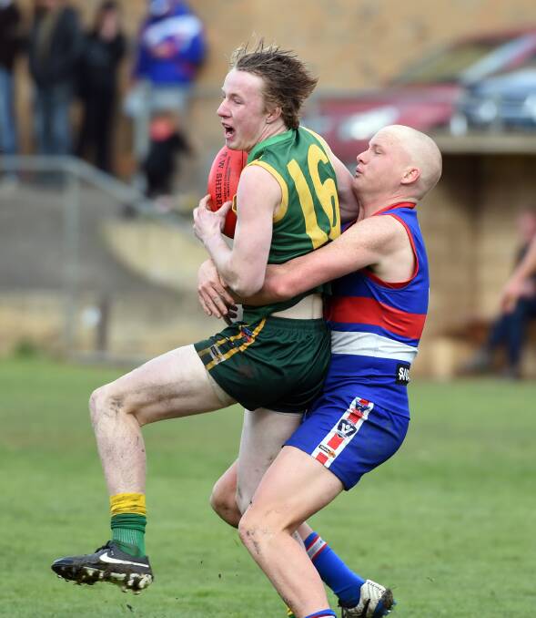 GOING NOWHERE: North Bendigo's Tyson Findlay wraps up Colbinabbin's Jeremy Morgan at Superior Roofing Oval on Saturday. Picture: LIZ FLEMING