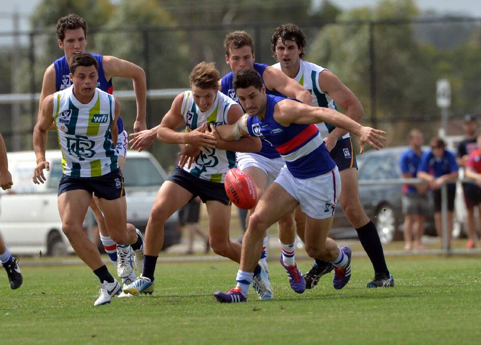 READY TO POUNCE: Bendigo and Footscray fight for possession in their practice match.
