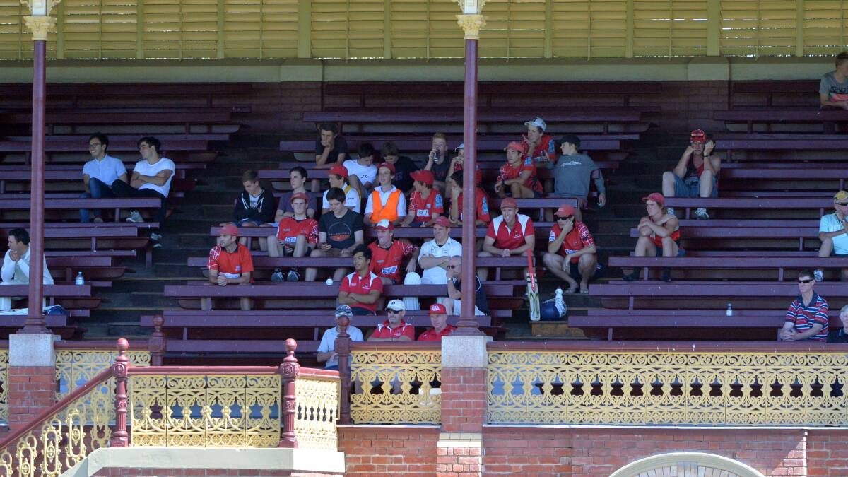 Bendigo United players and supporters in the grandstand.