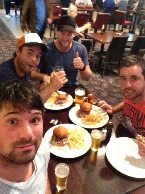 DINING OUT: Cameron Taylor, Linton Jacobs, Ben DeAraugo and Ben Gunn enjoy a meal and quiet beer. Picture: Cameron Taylor.