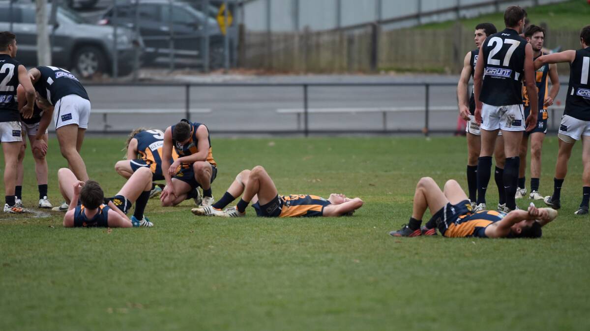 Bendigo Gold players after their five-point loss to the Northern Blues.