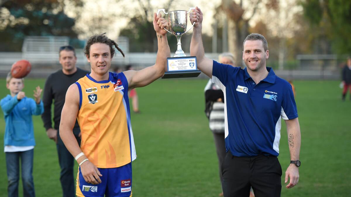 THE PRIZE: Bendigo captain Jack Geary and coach Rick Ladson after the win. Picture: JIM ALDERSEY
