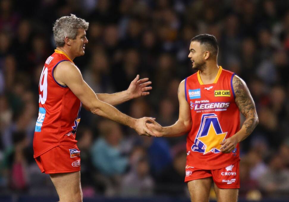 Shaun Smith (left) with Guy Sebastian during the 2013 EJ Whitten All-Stars game.