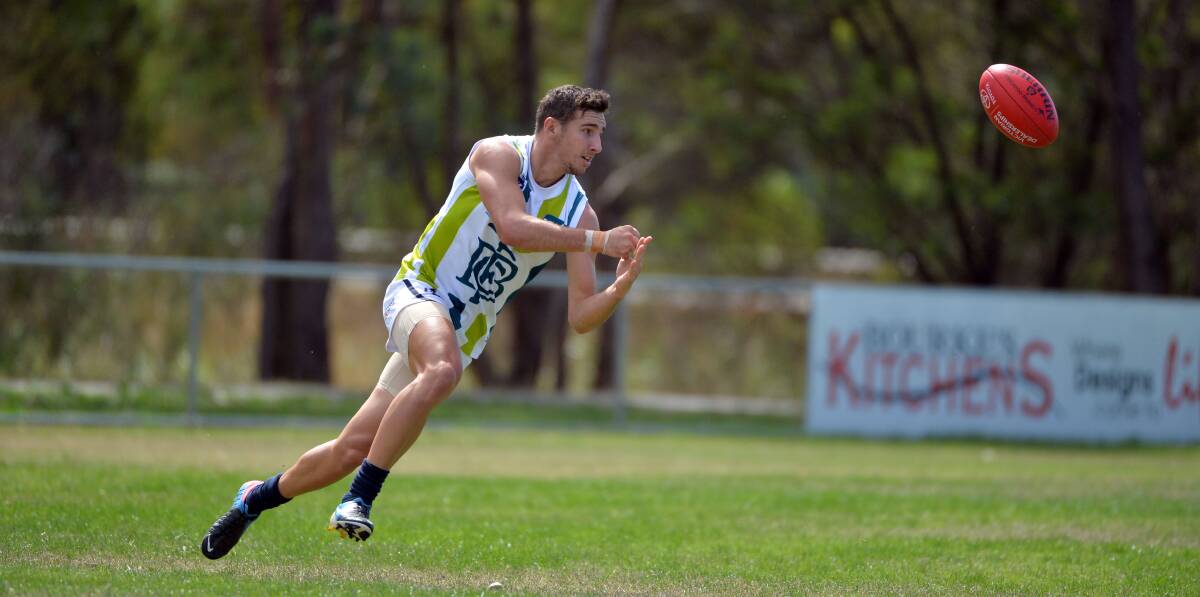 IN THE CLEAR: Bendigo Gold recruit Jesse Wallin fires off a handball on Saturday. Picture: LIZ FLEMING