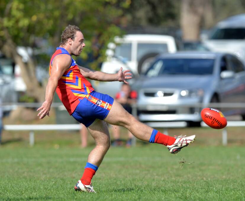 DAY OUT: Marong's Josh McKee boots one of his 10 goals against YCW.