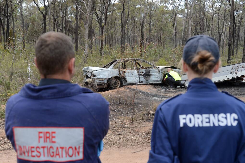 CRIME SCENE: The burnt out car in the Wellsford Forest. Picture: JIM ALDERSEY 