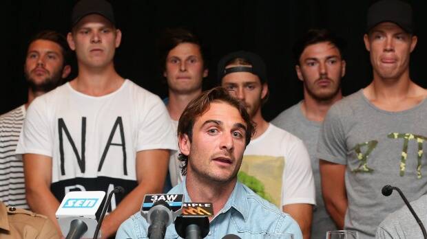 NOT GUILTY: Essendon captain Jobe Watson and the players face the media on Tuesday. Picture: THE AGE