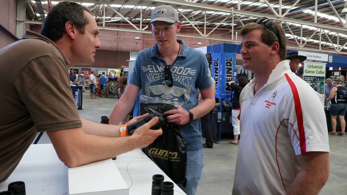 Colin Perkovic showing off Leica binoculars to James Cunning and Nick Wall

Picture: LIZ FLEMING
