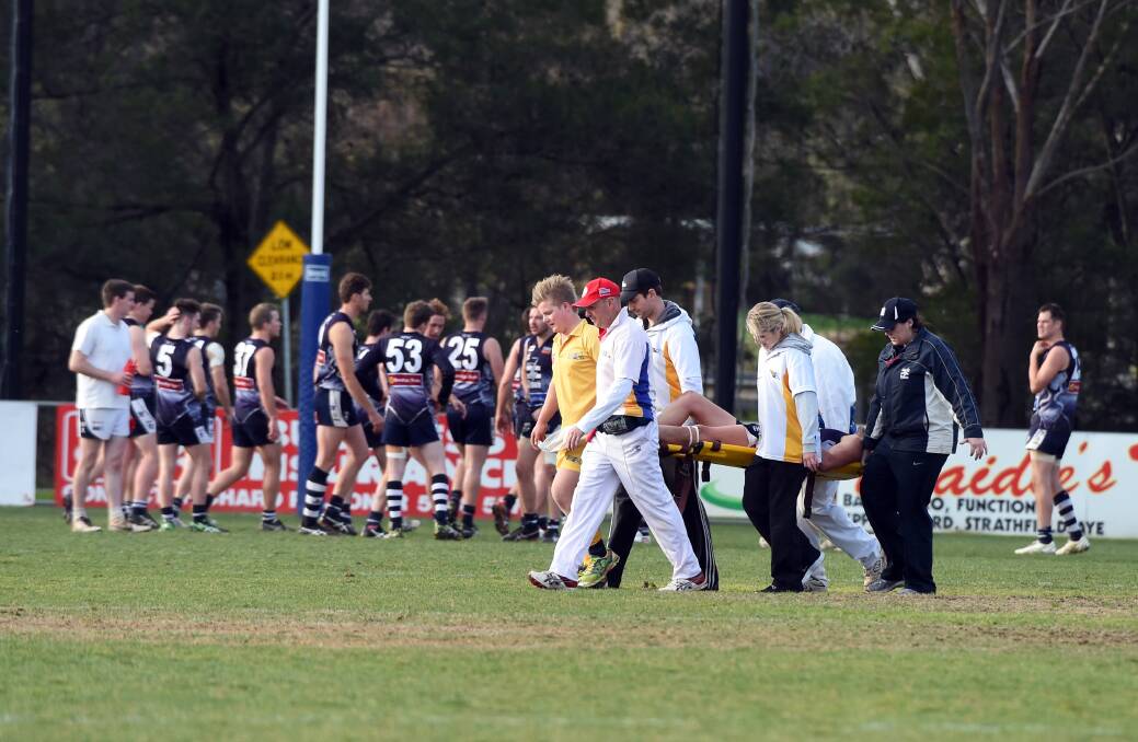 INJURY CURSE: Strathfieldsaye Storm star Nick Smith is carried off the ground after injuring his knee on Saturday. Picture: LIZ FLEMING