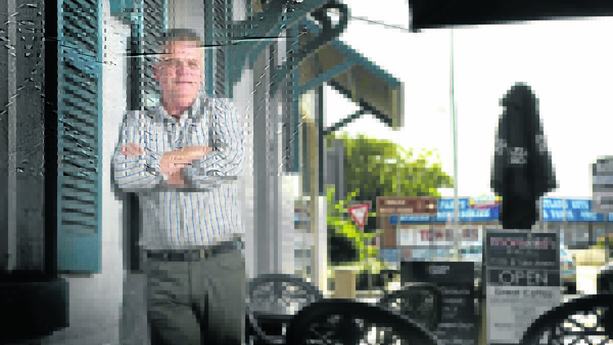 Moreish Cafe owner Howard Bourne agrees with new anti-smoking laws but says it’s draconian for the state government to expect businesses to enforce it under threat of a $5500 fine. Picture: PERRY DUFFIN