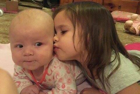Five-month-old Brydee with her sister Allyrah. A fundraising page has been set up to support her family for the coming months.