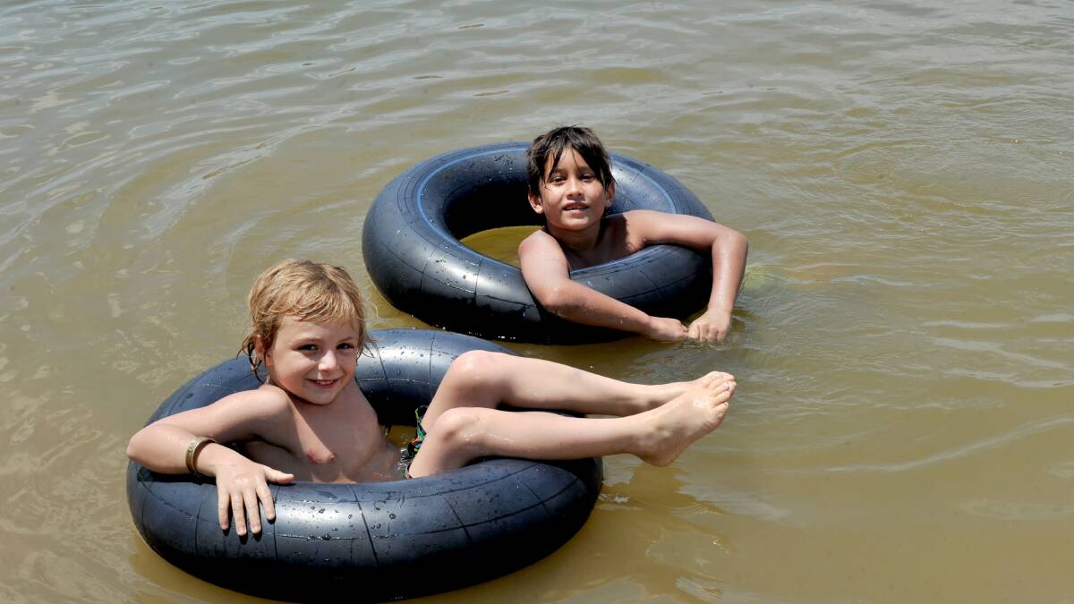 FLOATING AROUND: Jaxson Froelich, 7, and Silver Carson, 8. 
