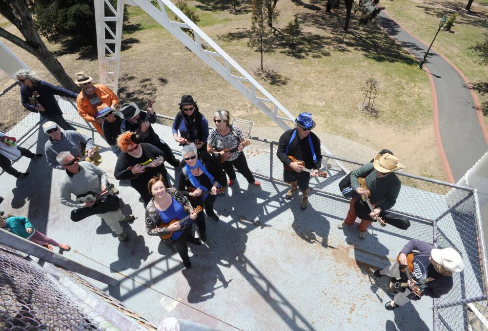 World record of ukulele players at the top of the poppet head to launch the Bendigo Blues and Roots Music Festival. 
Picture: JODIE DONNELLAN 