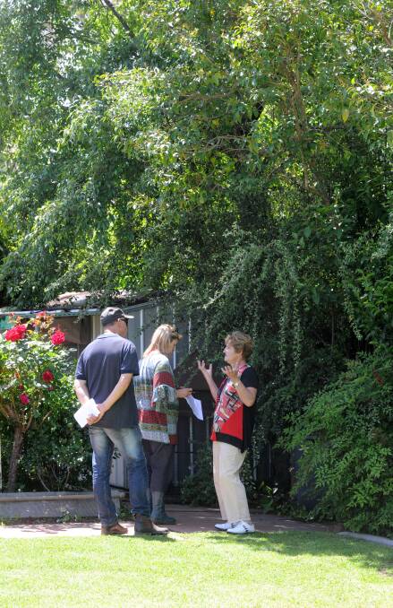 Owner of the property Margaret Richmond shows guests around her garden. Picture: JODIE DONNELLAN 