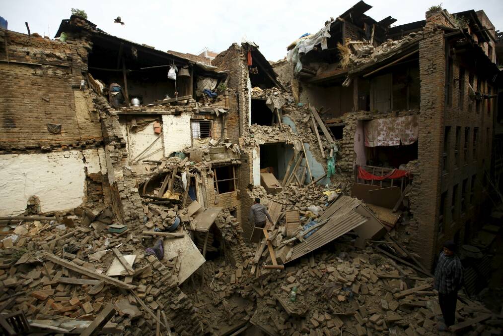 People search for family members trapped inside collapsed houses a day after an earthquake in Bhaktapur, Nepal. Picture: REUTERS