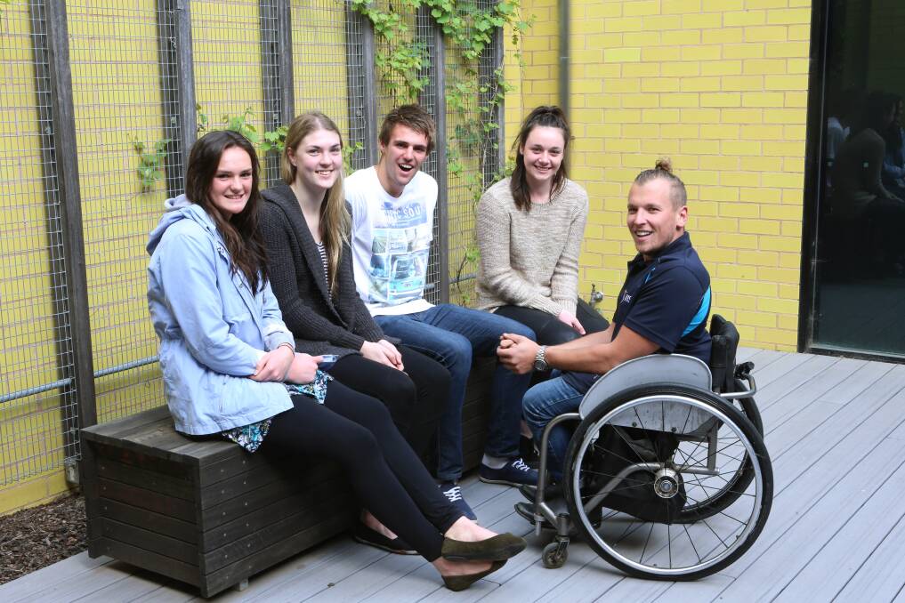 Paralympic basketballer Dylan Alcott chats to Bendigo Senior Secondary College basketballers Jessica Mangan, Molly Greetham, Jordan Mangan and Caitlin McLachlan at the school's elite sports lunch. Picture: PETER WEAVING