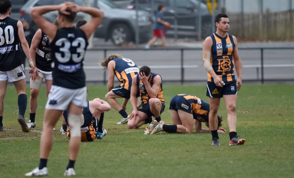 SHATTERED: Bendigo Gold players after the final siren sounds in their five-point loss to Northern Blues. Picture: JODIE DONNELLAN