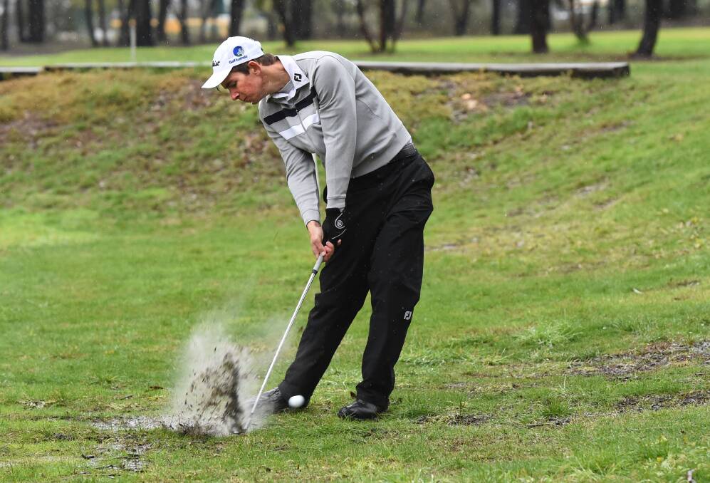 MAKING A SPLASH: Lucas Herbert blasts his second shot out of the rough at Neangar Park. Picture: PETER WEAVING