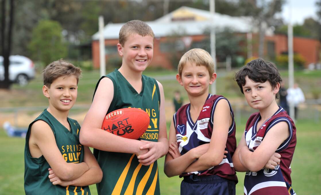FOOTY FUN: Spring Gully's Connor Sheppard and Jackson Hufer with Quarry Hill's Will Crane and Nicholas Lamplugh. Picture: JODIE DONNELLAN