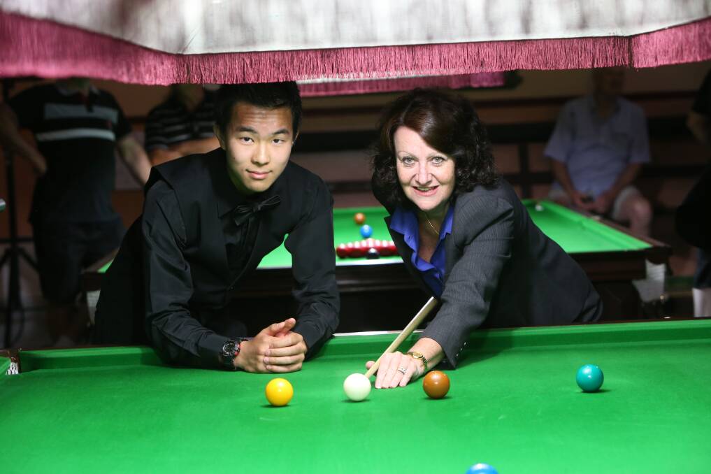 BREAK: Minister for Tourism and Major Events Louise Asher with Australian under-18 snooker champion Arthur Lin. Picture: BRENDAN McCARTHY