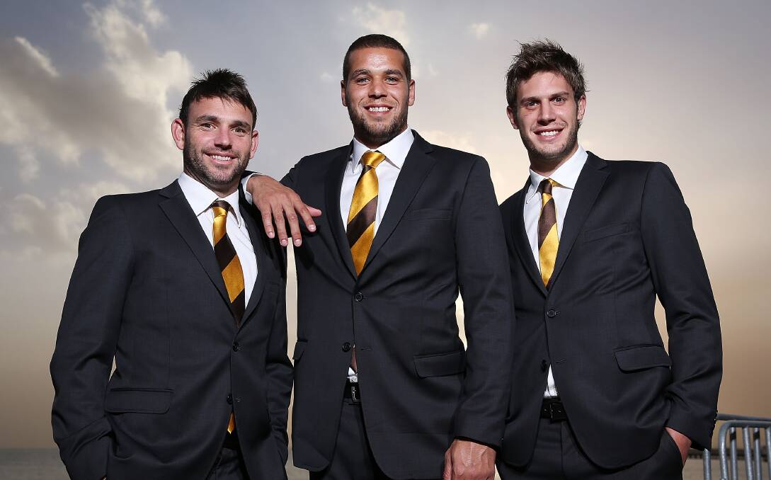 All dressed up with Lance Franklin and Grant Birchall at the launch of the Hawks' 2013 season. Picture: GETTY IMAGES