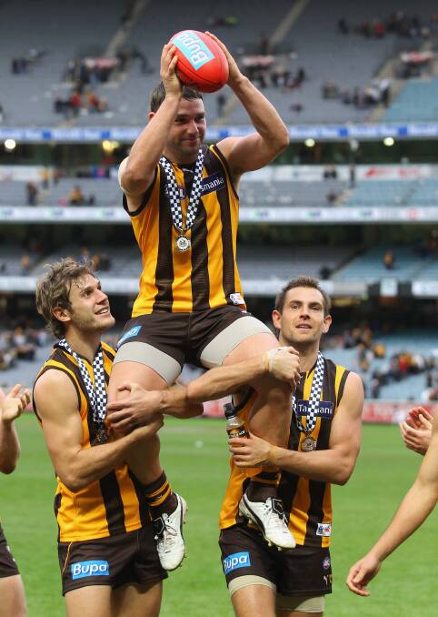 Chaired off the ground after his 200th AFL game - a win over the Saints in round eight, 2011. Picture: GETTY IMAGES