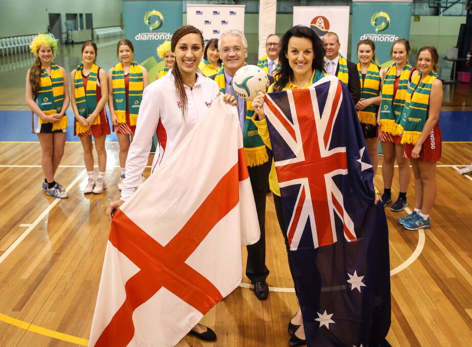 RIVALS: England's Geva Mentor and Australia's Bianca Chatfield with Minister for Sport Damian Drum at Bendigo Stadium. Picture: CHRIS GOTTAAS, NETBALL AUSTRALIA