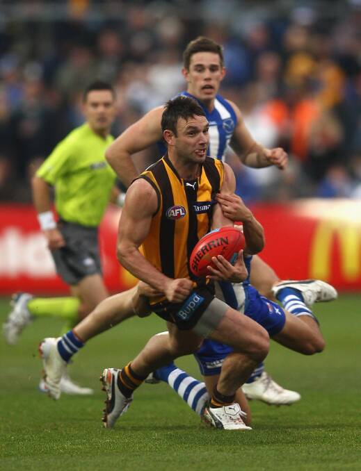 Firing out a handball against the Roos in round 10, 2012. Picture: GETTY IMAGES