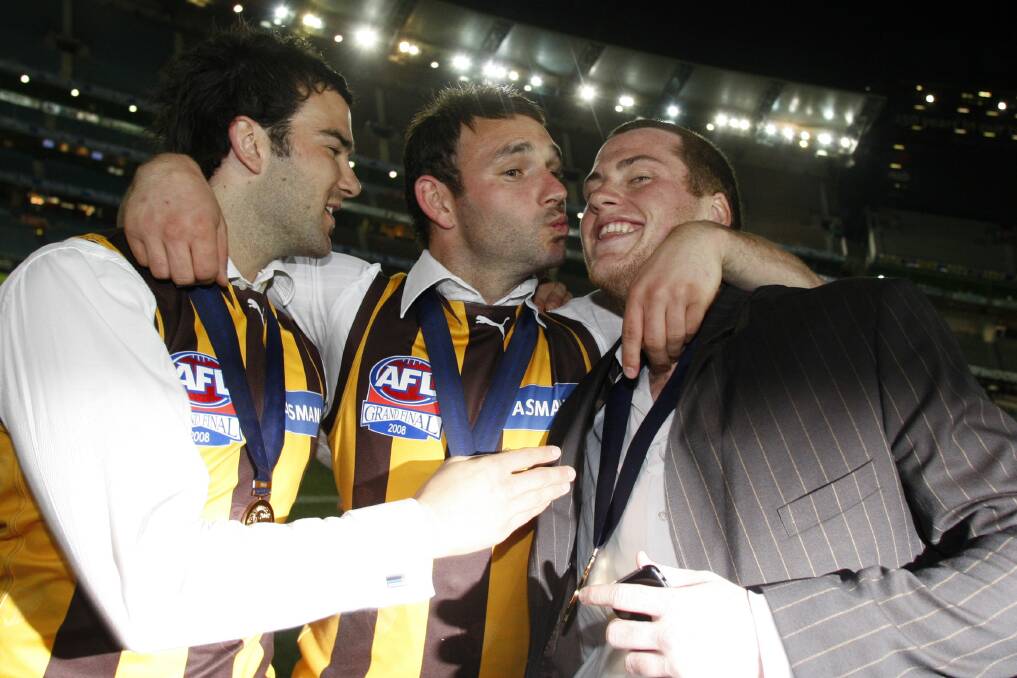 Celebrating the 2008 premiership with Jordan Lewis and Jarryd Roughead. Picture: GETTY IMAGES