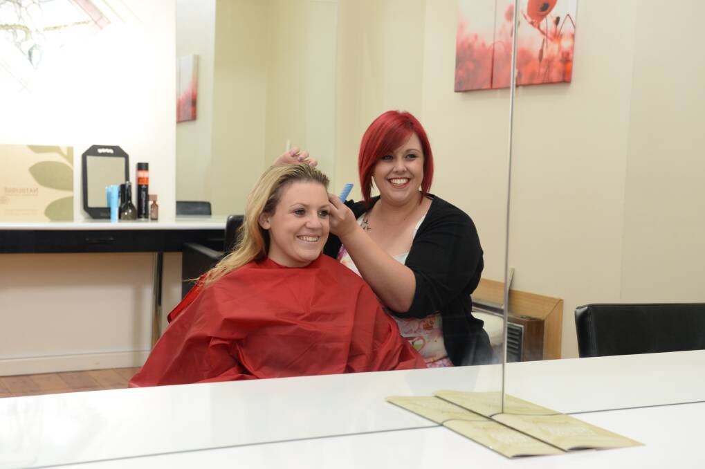 SMILES: Hairdressers Renee Ahearn and Ebony Brown from Teaze N Tanglez. Picture:JIM ALDERSEY
