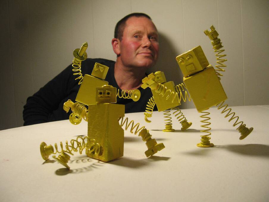 FUN: Peter Fountain with robots. Pictures: CONTRIBUTED