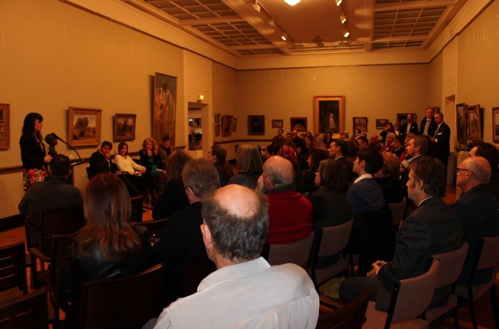DISCUSS: Many gathered for the event at the art gallery.