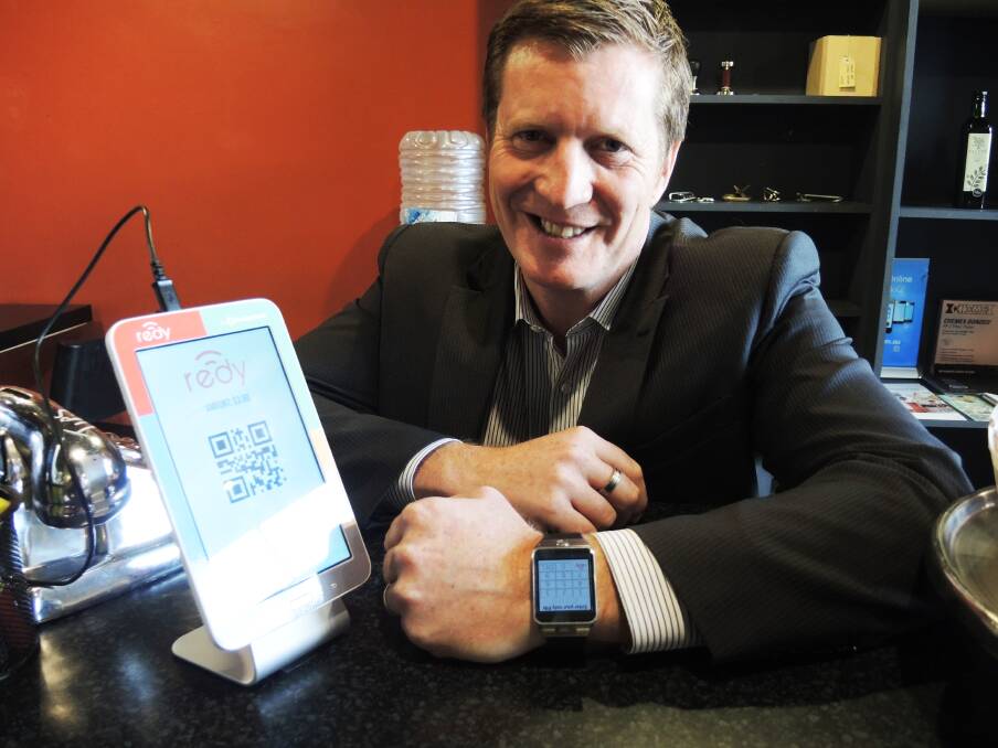 TECHNOLOGY: Community Telco Australia chief executive David Joss uses his watch with the new Redy system. Picture: LEIGH SHARP