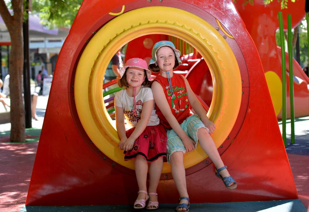FUN: Sienna, 6, and Bridie, 8, Newman on Fun Loong. Picture: JODIE DONNELLAN 