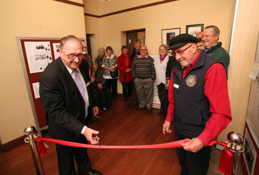 NEW: Mayor Barry Lyons cuts the ribbon with Jim Evans. Picture: PETER WEAVING