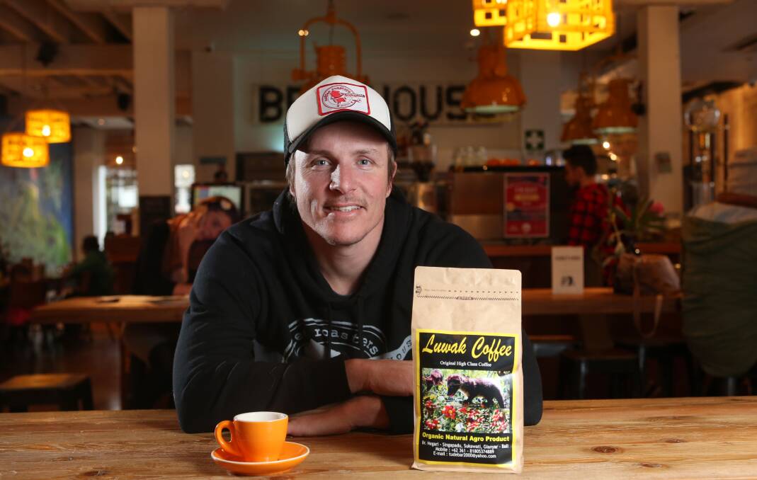 POO BREW: Corey Scoble with a cup of the Luwak bean coffee. Picture: GLENN DANIELS