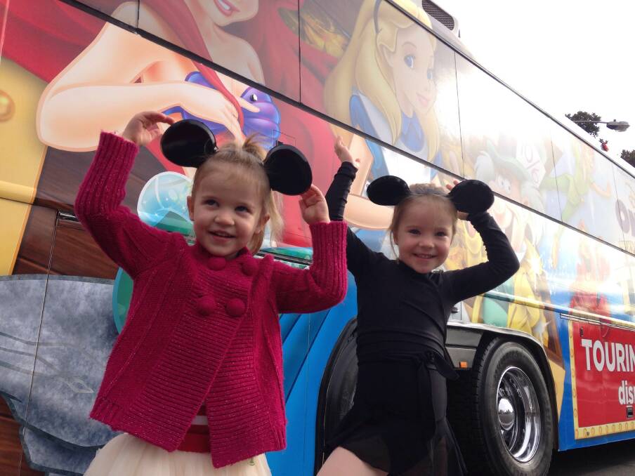 FANS: ZoZo, 3,  and Sammie, 4, in front of the bus. Picture: CONTRIBUTED