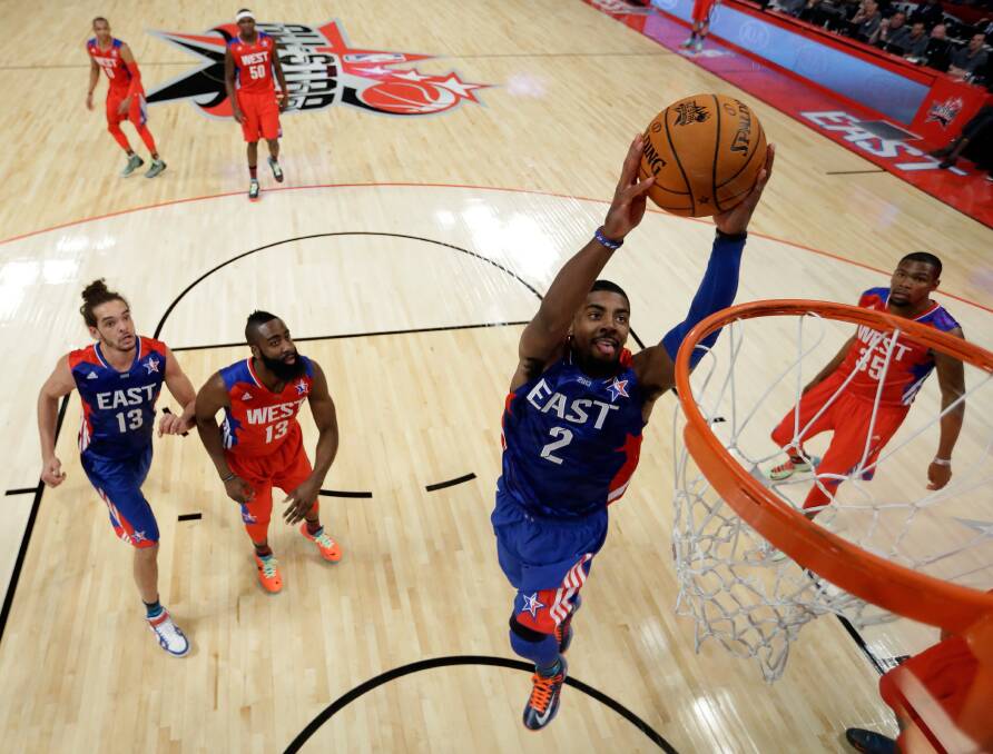 HAMMER TIME: Cleveland Cavalier Kyrie Irving sets up for a slam dunk in the NBA All-Star game. Picture: GETTY IMAGES