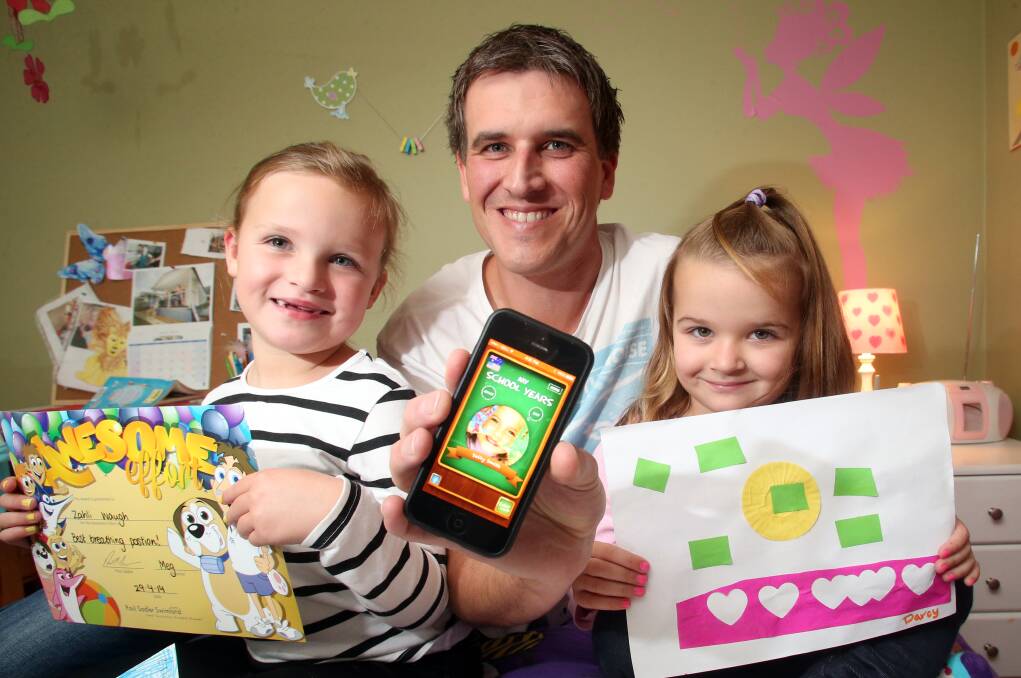 DESIGN: Andrew Waugh with Zahli, 6 and Darcey, 3.