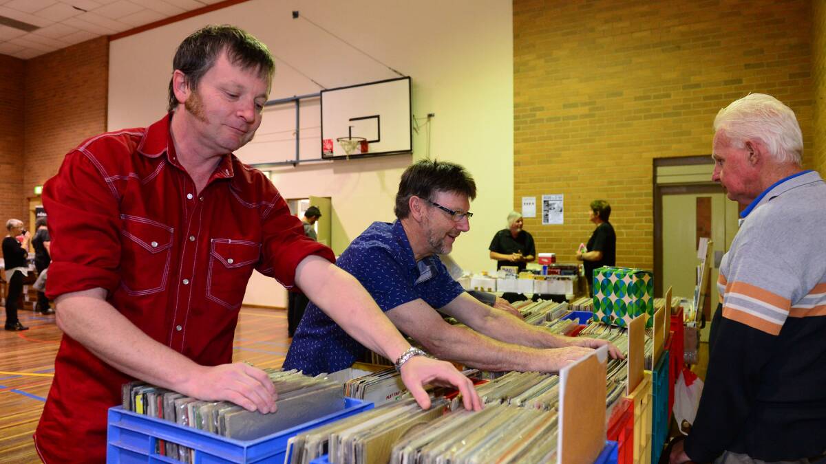 SIFTING: Kieran Clancy and Allan Trevena checking out Rocking Robert's stall. Picture: LIZ FLEMING