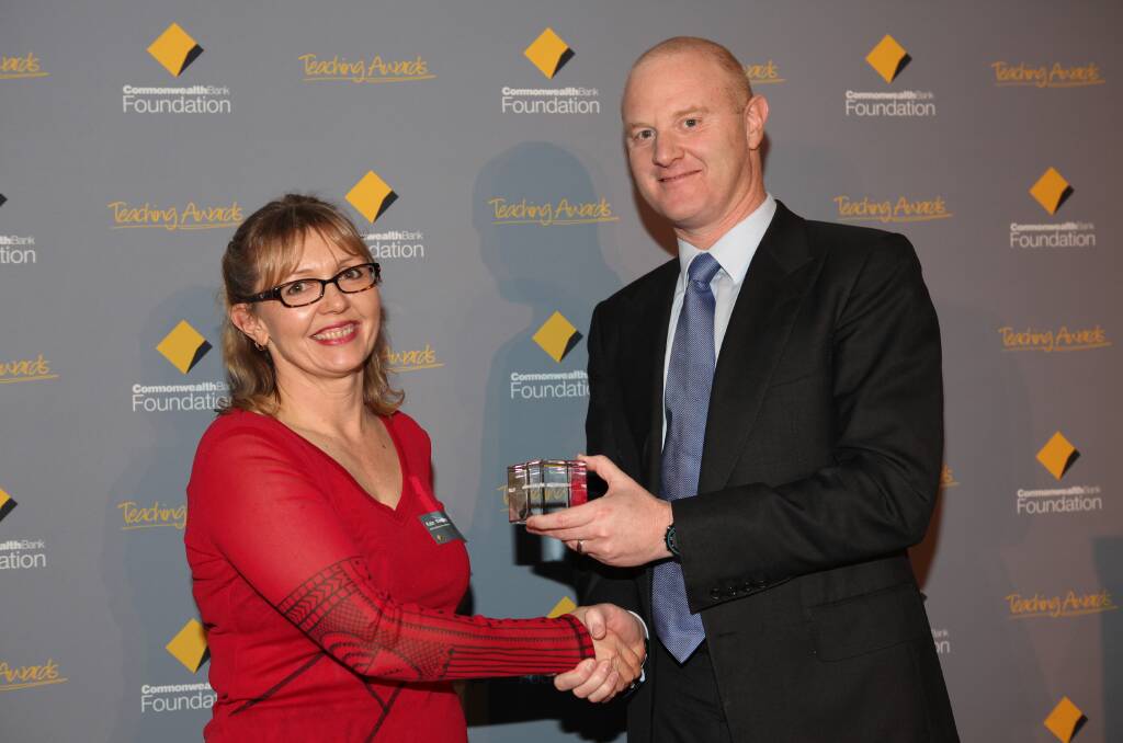 ACHIEVEMENT: Commonwealth Bank chief executive Ian Narev presenting Kate Bentley with the award. 