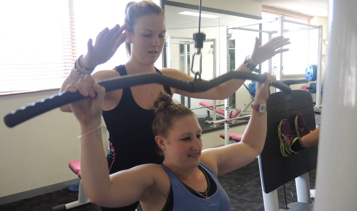 PUMPING: Fernwood personal trainer Jess Pethcybridge with member Christie-lee Wyer.