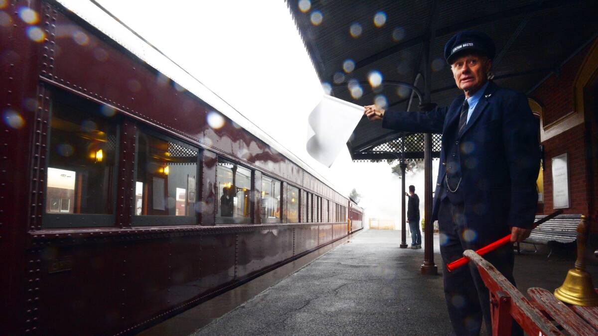 ALL ABOARD: Station master Art Lynch seeing the excited passengers off. Pictures: BRENDAN McCARTHY.