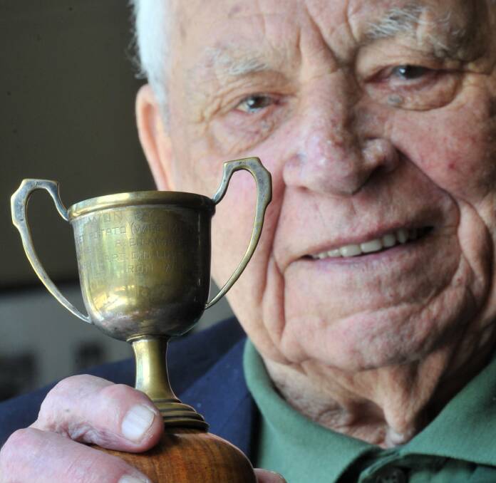 HONOUR: Alf Maskell holding the prisoner of war Melbourne cup trophy. Picture: PETER WEAVING